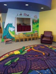 colorful rug and painted walls, with kid-sized wood chairs