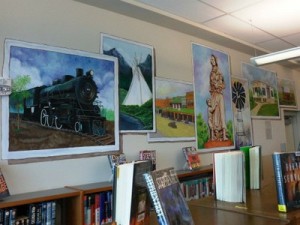 colorful paintings on display in the library